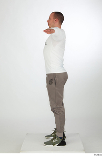 Joel dressed green sneakers grey jogger pants sports standing t-pose…